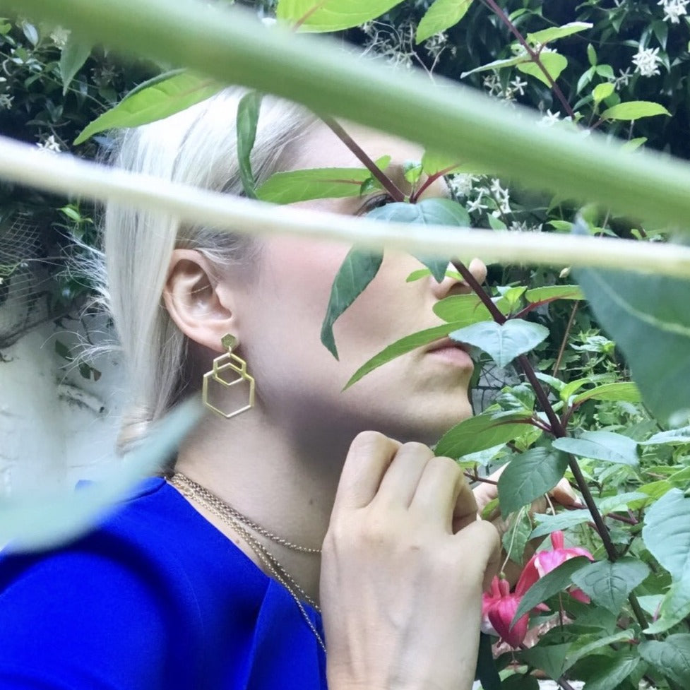 Eye-catching and easy to wear light hexagon-shaped earrings from popular Cell collection. Material: 18 karat gold-plated silver. Size: earrings' length is approximately 5cm.