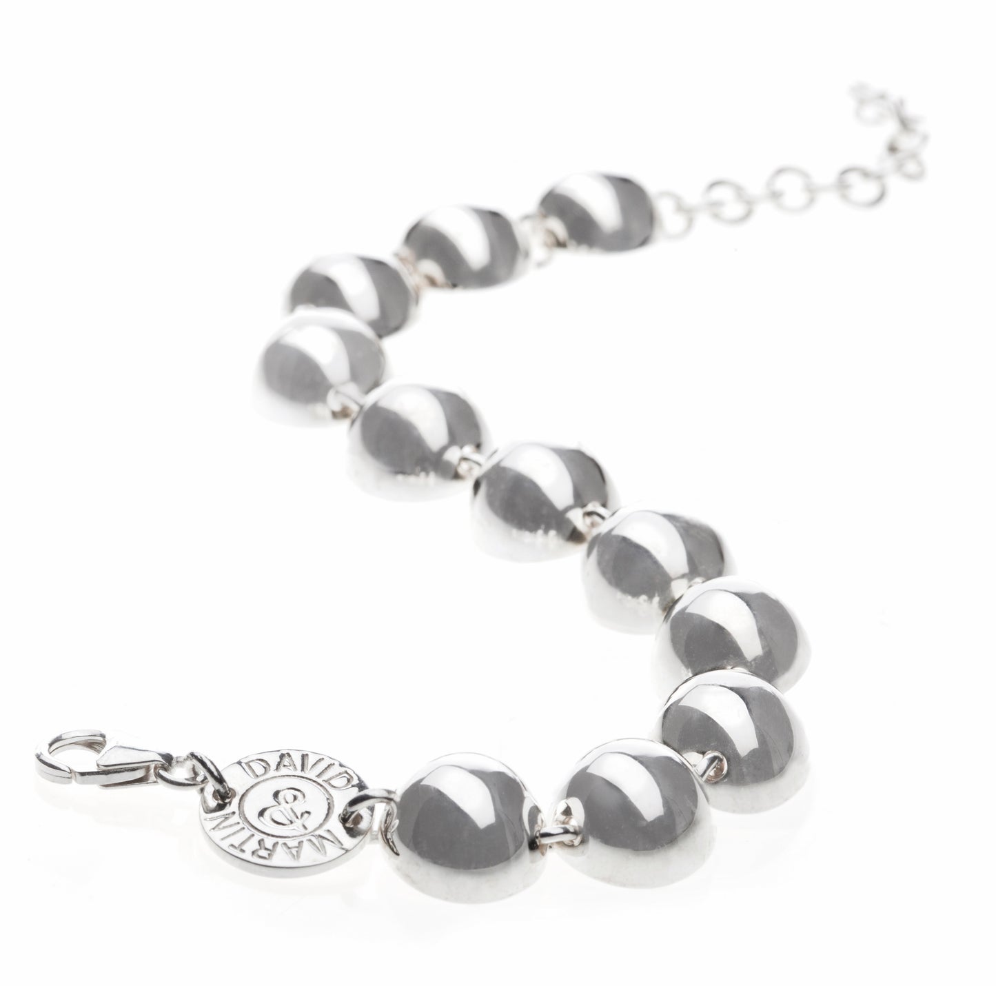 A semi-spherical silver bracelet from conceptual futuristic Cosmic Collection.