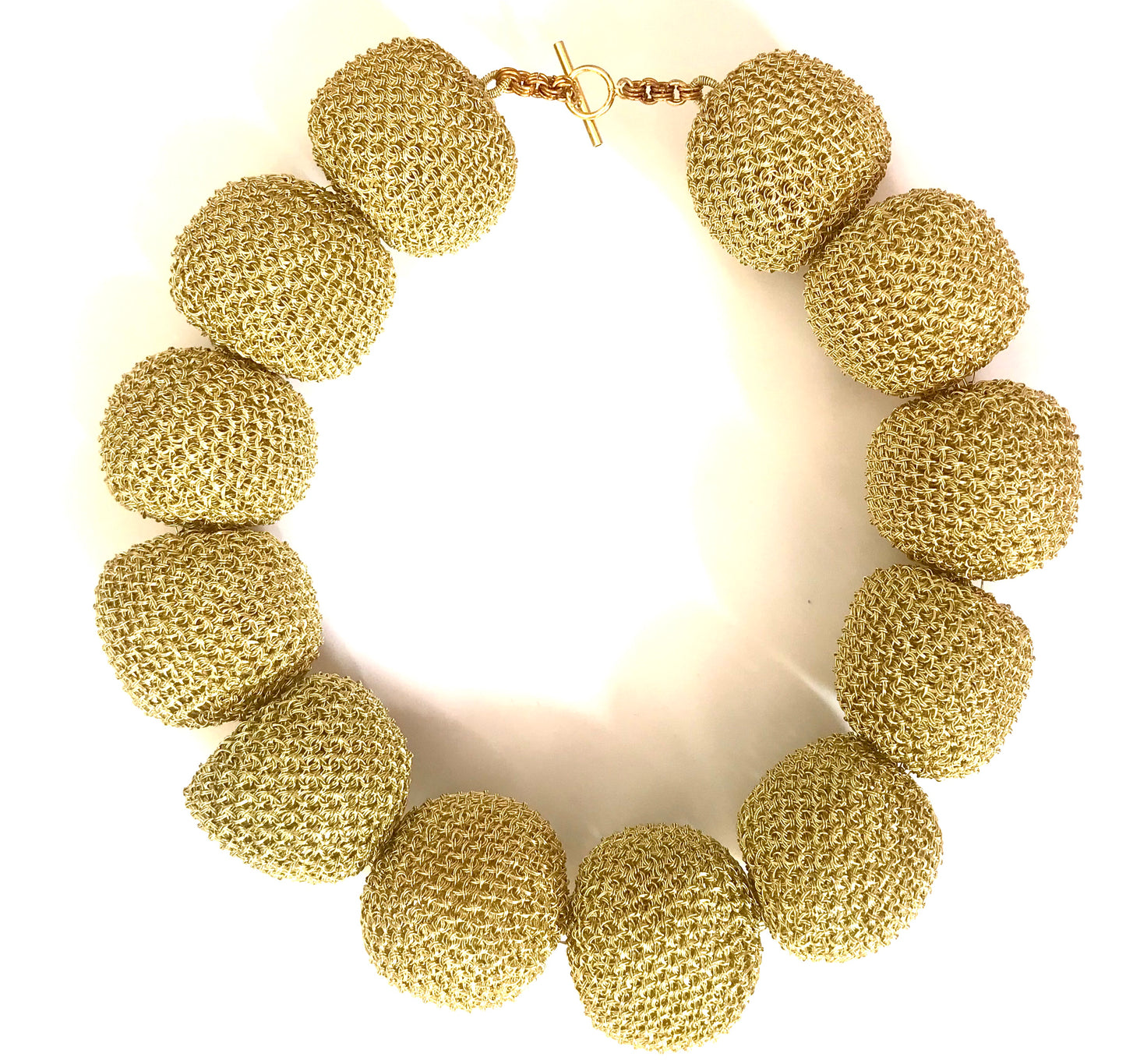 Unique, one of a kind, handcrafted statement Perle D'Oro necklace from Venice collection. The necklace is made of oversized gold-plated wire pearls. Venice collection is designed in Stockholm, Sweden and inspired by the beauty and traditions of Venetian culture. It brings together the Scandinavian aesthetics and its tendency towards simplicity with the allure and colourful, sophisticated lavishness of Venice.