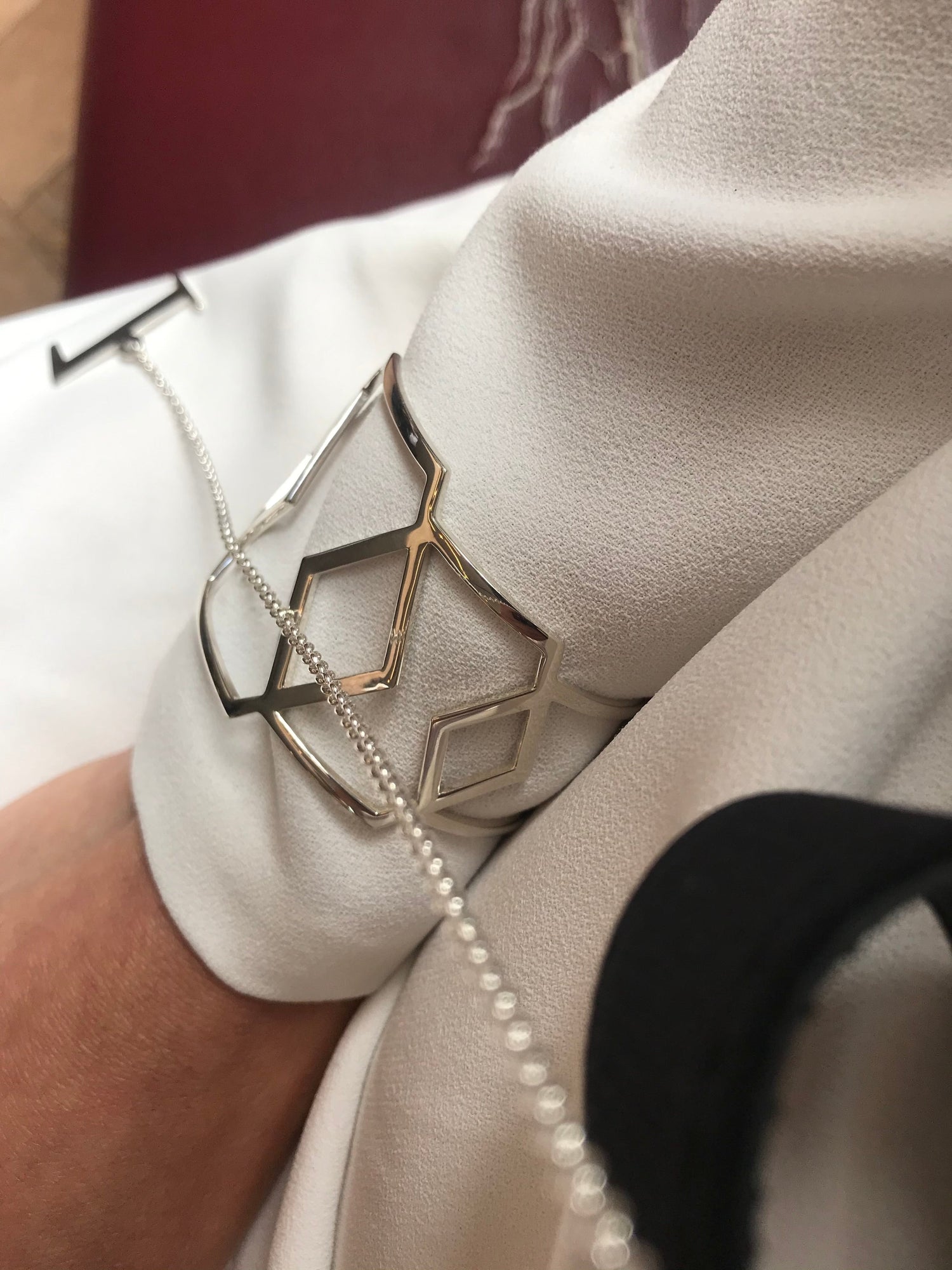 Geometric cuff bracelet from Cell collection by David&Martin Jewellery. Hexagon-shaped, made of 925 silver.