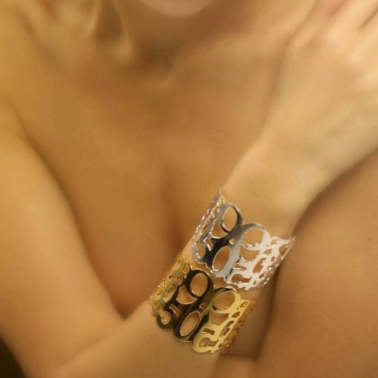Conceptual chunky cuff bracelet from popular Numbers collection. Material: 18 karat gold-plated silver. Size: adjustable, fits any wrist.