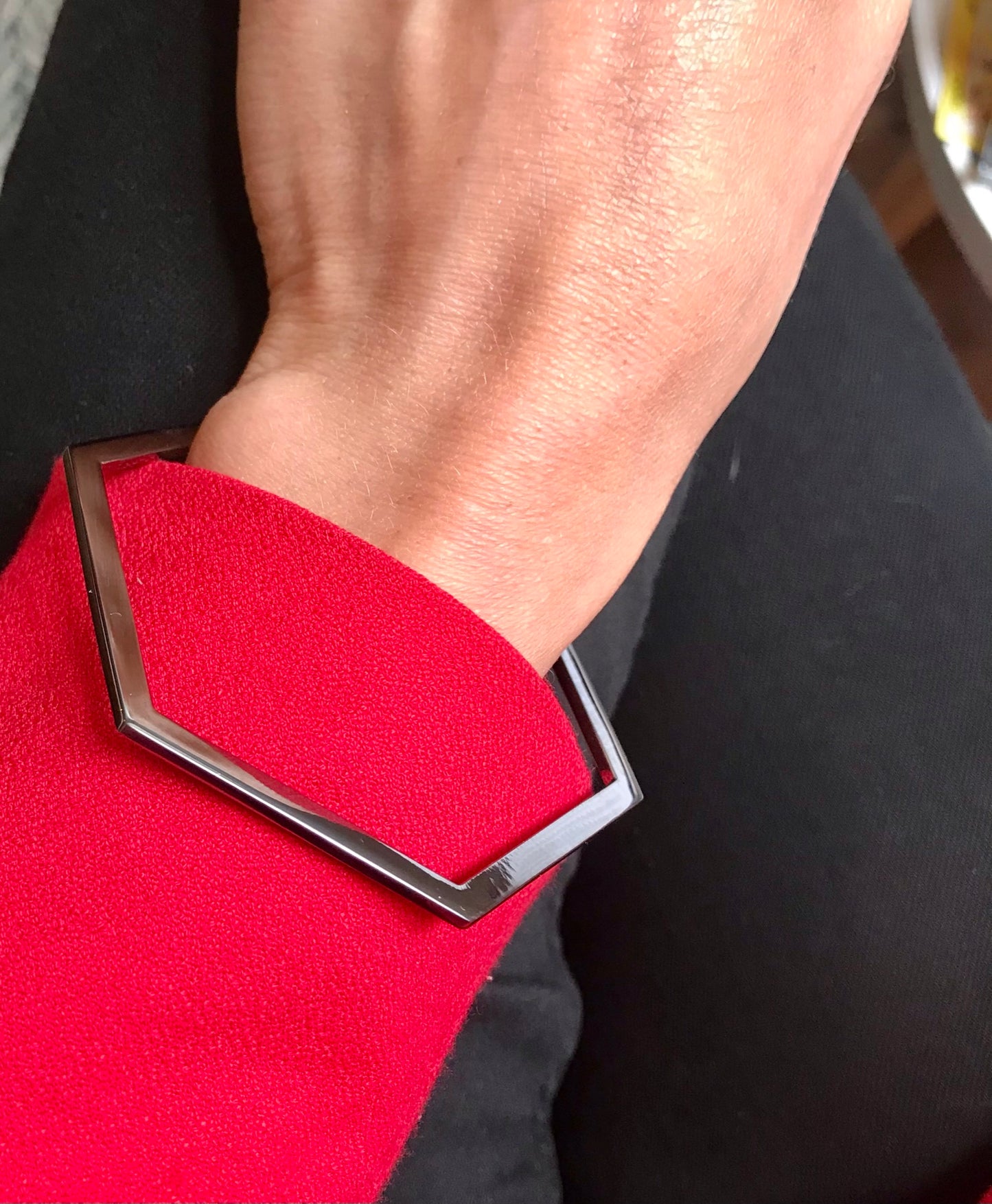 Minimalist hexagon-shaped bangle from Cell collection. Signature geometric design. Material: Rhodium-plated silver.
