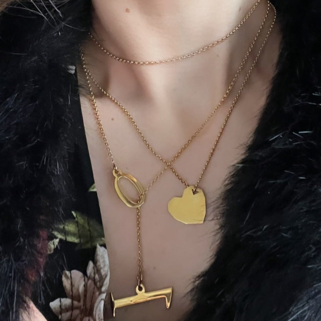 Long slip-through necklace with Zero and One pendants from Numbers collection. The chain is long enough to be wrapped around the neck twice and the item can be worn as long necklace or a choker with a pendant. Material: 18 karat gold-plated 925 silver. Size: 90cm.