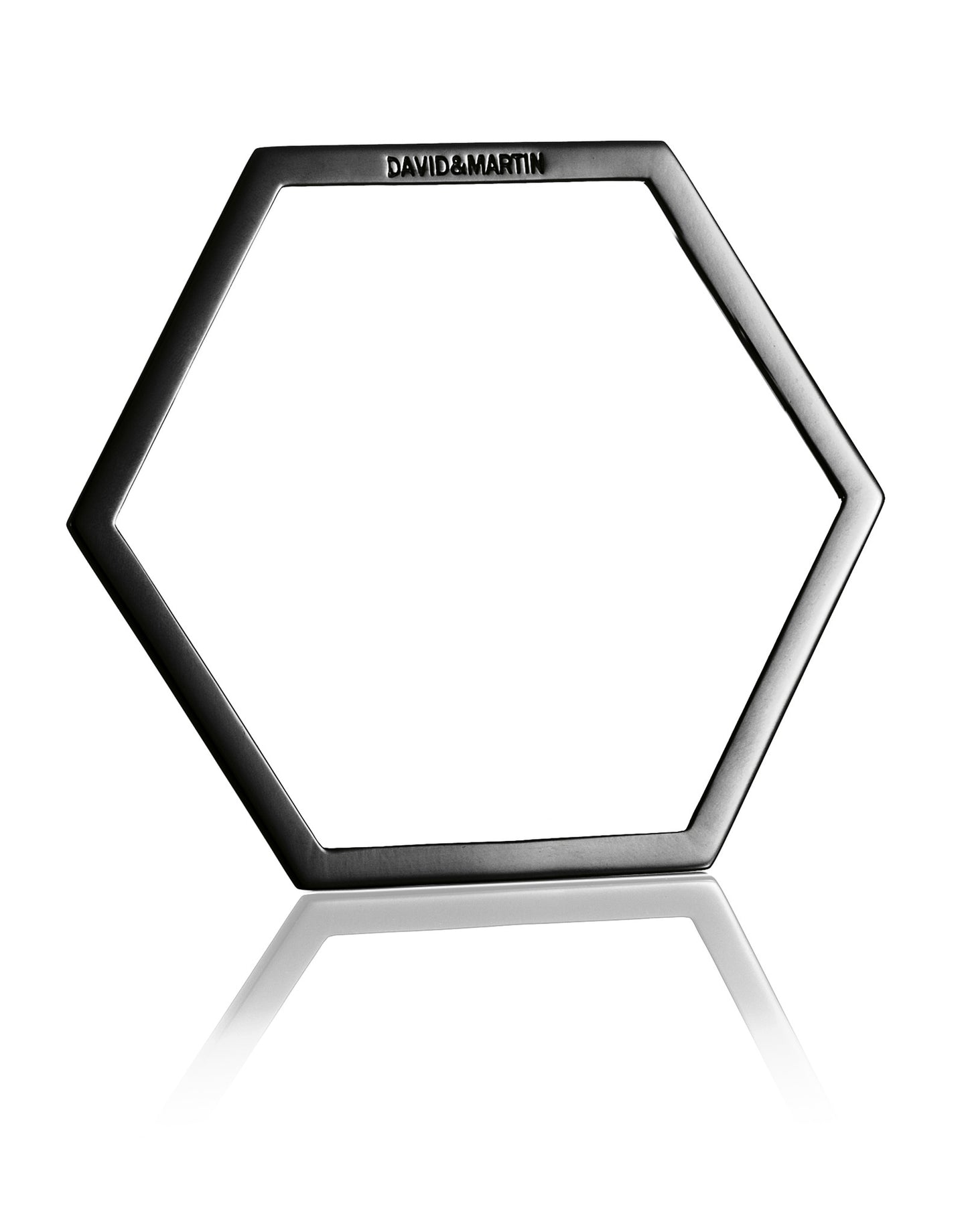 Minimalist hexagon-shaped bangle from Cell collection. Signature geometric design. Material: Rhodium-plated silver.