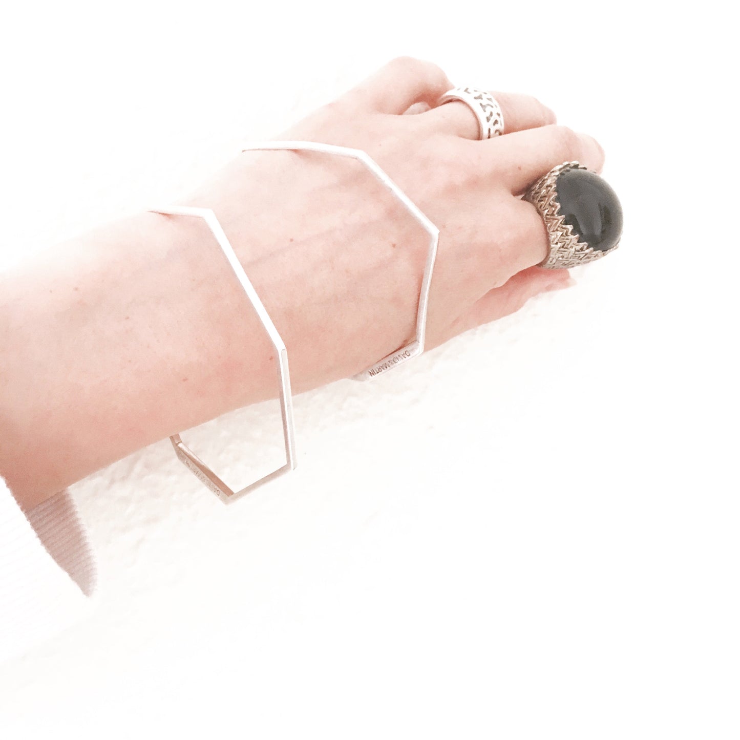 Minimalist bangle bracelet from iconic Facet collection. Material: 925 silver.