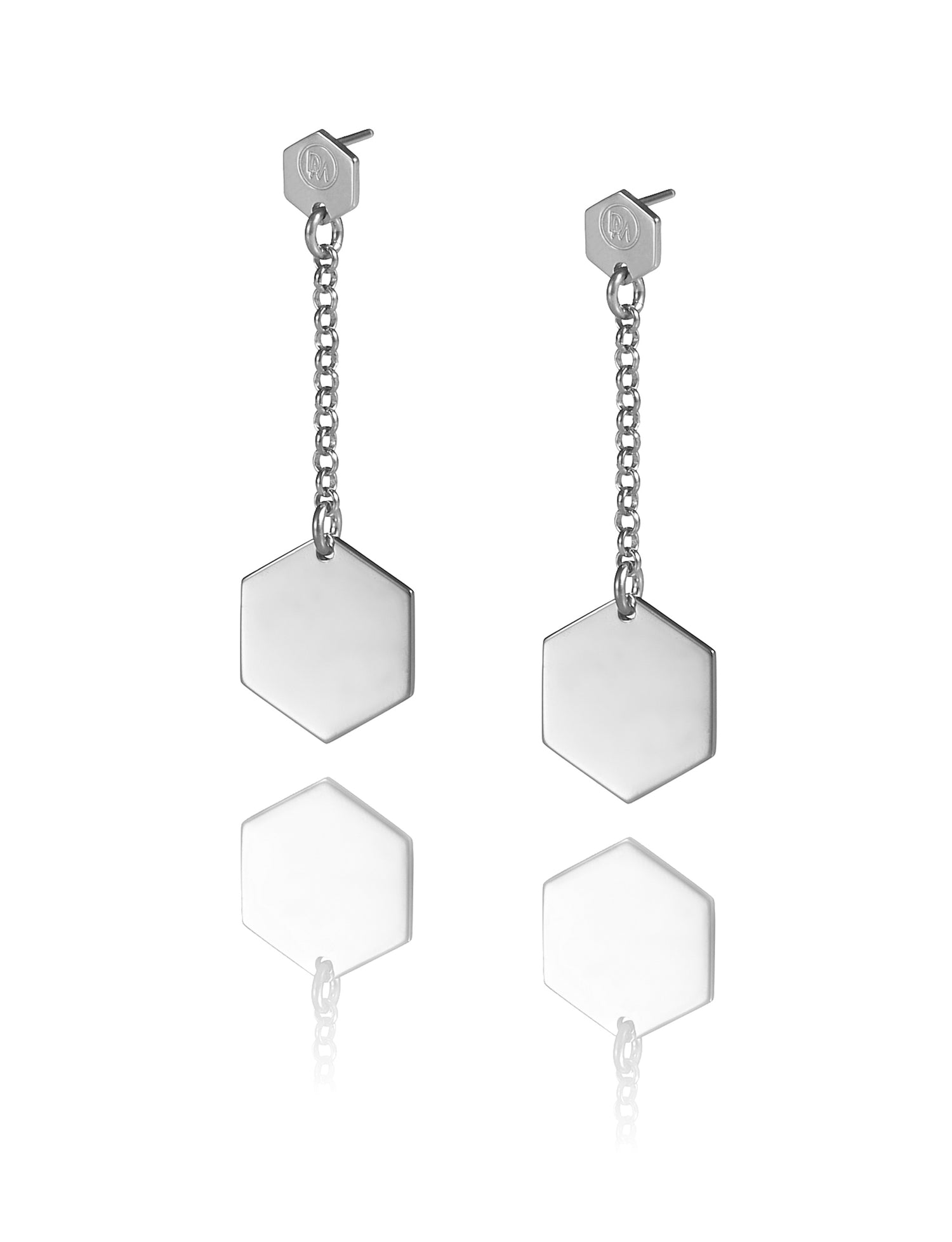Minimalist and playful Cell earrings with hexagon-shaped pendants from iconic Cell collection by David&Martin.  Material: 925 silver.