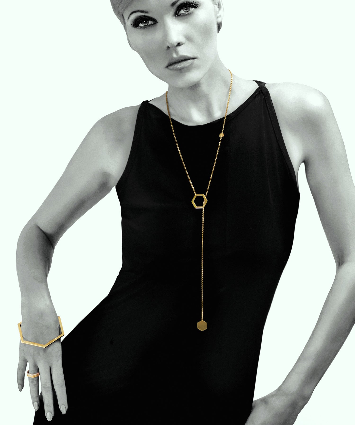 18 karat gold plated 925 silver slip-through necklace with hexagon-shaped pendant.   The chain can be wrapped around the neck twice, turning this long necklace into a choker.  Original design from iconic Cell collection by David&Martin.  Total length 90cm.