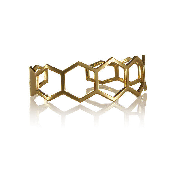 Minimalist and light hexagon-shaped cuff bracelet from popular Cell collection.  Material: 18 karat gold-plated silver. Size: adjustable, fits any wrist. 